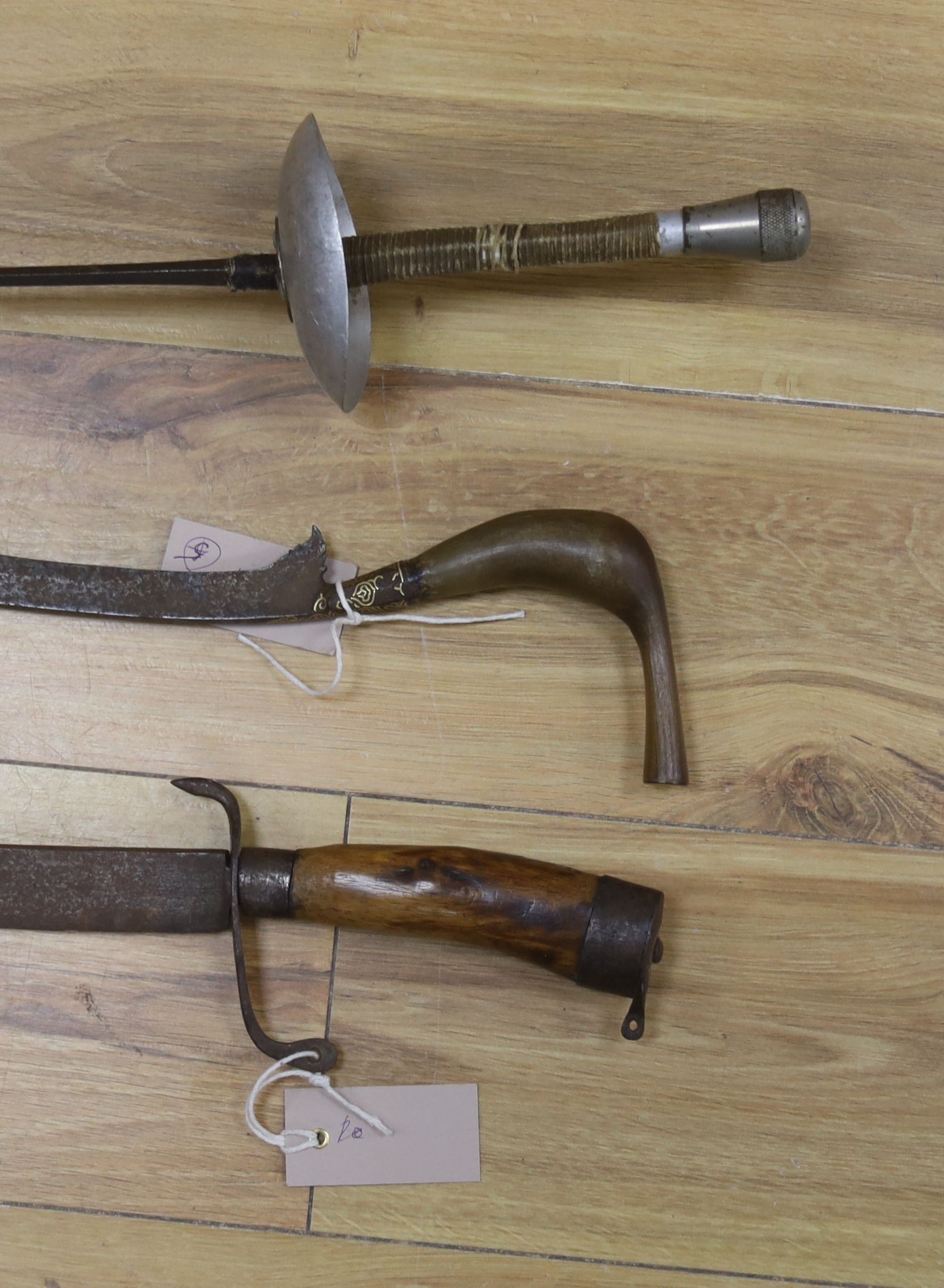 A Dutch East Indies short sword / kris having horn handle and gold inlay, another similar, a late 19th century sword and scabbard, an epee and another sword (5)